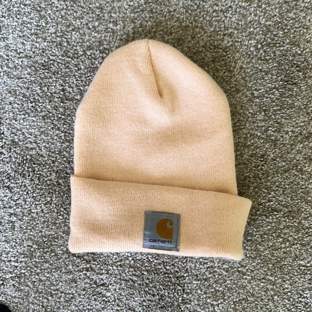 Carhartt beanie in salmon color.